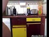 Blonde girl naked in the kitchen